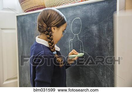 Mixed race girl drawing on chalkboard View Large Photo Image Stock Photo - Mixed race girl drawing on chalkboard. Fotosearch