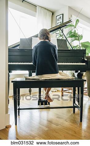Mixed race girl playing piano View Large Photo Image Stock Image - Mixed race girl playing piano. Fotosearch