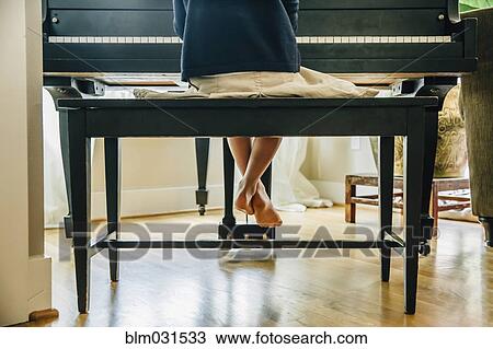Mixed race girl playing piano View Large Photo Image Stock Image - Mixed race girl playing piano. Fotosearch