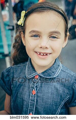 Stock Photography - Mixed race girl smiling outdoors. Fotosearch