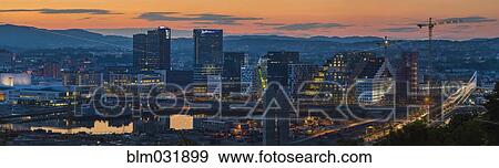 Panoramic view of Oslo city skyline at sunset, Ostlandet, Norway View Large Photo Image Stock Photo - Panoramic view of Oslo city skyline at sunset, Ostlandet, Norway. Fotosearch