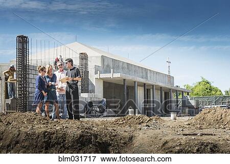 People talking at construction site View Large Photo Image Stock Photo - People talking at construction site. Fotosearch