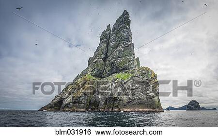 Stock Photograph - Rock formation in ocean, Stornoway, Scotland, United Kingdom. Fotosearch