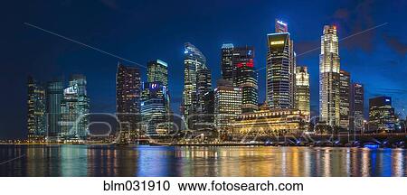 Skyscrapers in Singapore city skyline illuminated at night, Singapore View Large Photo Image Stock Image - Skyscrapers in Singapore city skyline illuminated at night, Singapore. Fotosearch