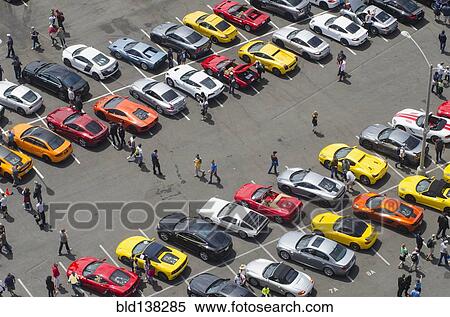 Aerial view of people walking in parking lot View Large Photo Image Stock Photography - Aerial view of people walking in parking lot. Fotosearch