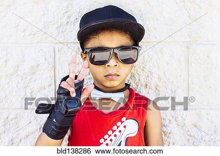 African American boy wearing bow tie, wrist brace, sunglasses and baseball cap View Large Photo Image Stock Photograph - African American boy wearing bow tie, wrist brace, sunglasses and baseball cap. Fotosearch