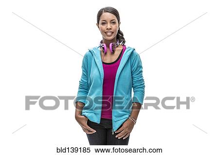 Stock Photography - African American woman wearing headphones. Fotosearch