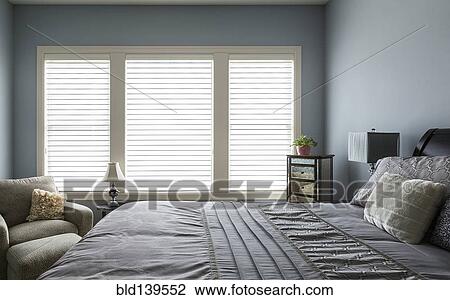 Armchair, bed and dresser in modern bedroom View Large Photo Image Stock Image - Armchair, bed and dresser in modern bedroom. Fotosearch
