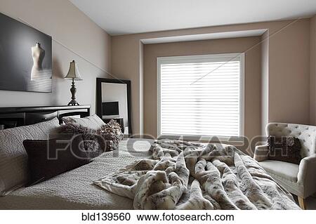 Bed, window and armchair in modern bedroom View Large Photo Image Stock Image - Bed, window and armchair in modern bedroom. Fotosearch