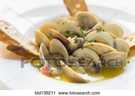 Bowl of clams with bread View Large Photo Image Stock Image - Bowl of clams with bread. Fotosearch