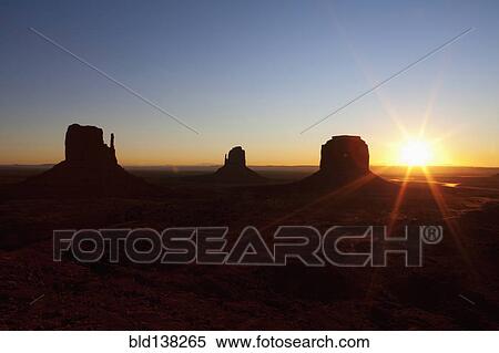 Butte rock formations in desert landscape at sunset, Monument Valley Tribal Park, Utah, United States View Large Photo Image Stock Photography - Butte rock formations in desert landscape at sunset, Monument Valley Tribal Park, Utah, United States. Fotosearch