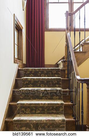 Carpeted staircase and bannister in rustic house View Large Photo Image Stock Image - Carpeted staircase and bannister in rustic house. Fotosearch