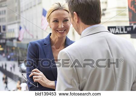 Caucasian business people talking in city, New York City, New York, United States View Large Photo Image Stock Image - Caucasian business people talking in city, New York City, New York, United States. Fotosearch