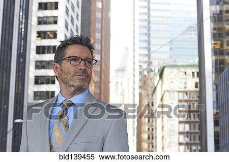 Caucasian businessman standing in city, New York City, New York, United States View Large Photo Image Stock Photography - Caucasian businessman standing in city, New York City, New York, United States. Fotosearch
