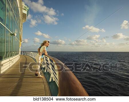 Caucasian couple admiring view from boat deck View Large Photo Image Picture - Caucasian couple admiring view from boat deck. Fotosearch