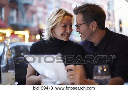 Caucasian couple eating at urban cafe, New York City, New York, United States View Large Photo Image Stock Image - Caucasian couple eating at urban cafe, New York City, New York, United States. Fotosearch