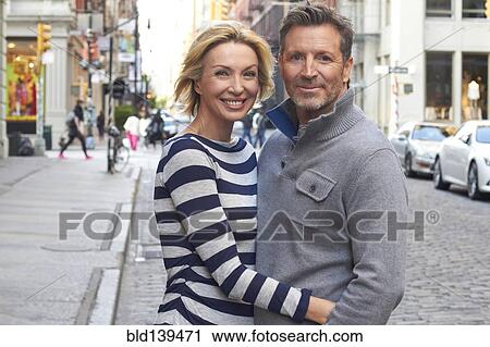 Caucasian couple hugging on city street, New York City, New York, United States View Large Photo Image Stock Image - Caucasian couple hugging on city street, New York City, New York, United States. Fotosearch