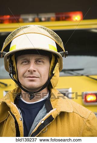 Caucasian firefighter wearing uniform and helmet View Large Photo Image Stock Photo - Caucasian firefighter wearing uniform and helmet. Fotosearch