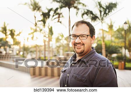 Caucasian man smiling outdoors View Large Photo Image Picture - Caucasian man smiling outdoors. Fotosearch