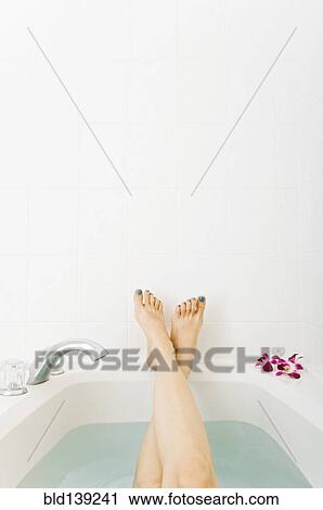 Caucasian woman relaxing in bathtub View Large Photo Image Stock Image - Caucasian woman relaxing in bathtub. Fotosearch