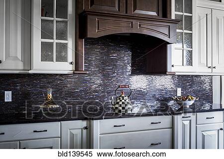 Checkered teapot on stove in kitchen View Large Photo Image Stock Photography - Checkered teapot on stove in kitchen. Fotosearch