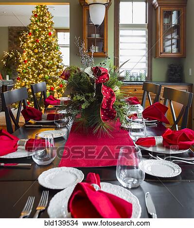 Picture - Christmas table and tree in dining room. Fotosearch