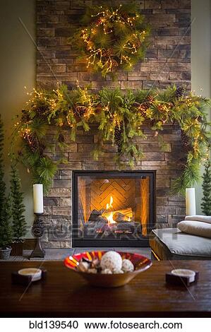 Christmas Wreaths Over Fireplace In Living Room Stock Image