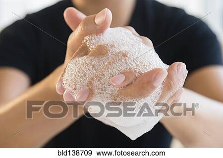 Close up of mixed race man washing his hands View Large Photo Image Stock Photo - Close up of mixed race man washing his hands. Fotosearch