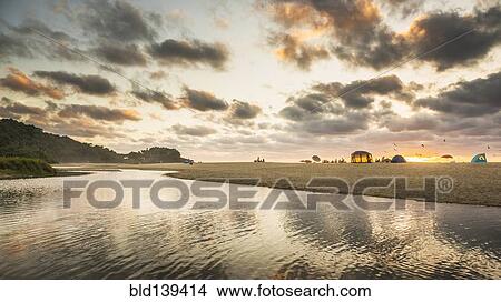 Picture - Clouds and still pool on beach. Fotosearch