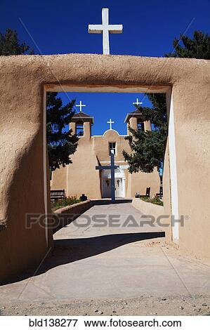 Crosses and entrance of adobe church, Ranchos de Taos, New Mexico, United States View Large Photo Image Stock Photo - Crosses and entrance of adobe church, Ranchos de Taos, New Mexico, United States. Fotosearch