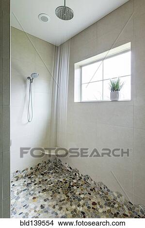 Custom floor and dual shower head in modern bathroom View Large Photo Image Picture - Custom floor and dual shower head in modern bathroom. Fotosearch