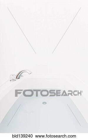 Faucet over full bathtub View Large Photo Image Stock Image - Faucet over full bathtub. Fotosearch
