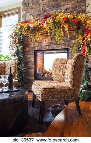 Glasses with wine bottle in living room at Christmas View Large Photo Image Stock Photo - Glasses with wine bottle in living room at Christmas. Fotosearch