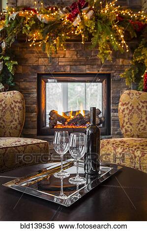 Glasses with wine bottle in living room at Christmas View Large Photo Image Stock Photograph - Glasses with wine bottle in living room at Christmas. Fotosearch