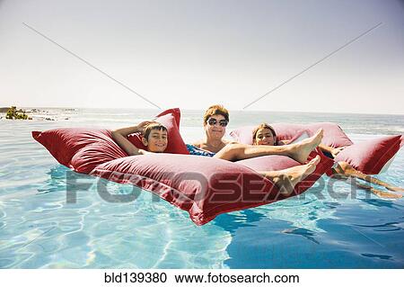 Grandmother and grandchildren relaxing on pool raft View Large Photo Image Stock Image - Grandmother and grandchildren relaxing on pool raft. Fotosearch