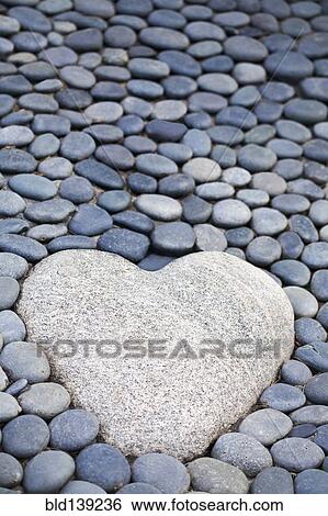 Heart-shaped stone on path View Large Photo Image Stock Photograph - Heart-shaped stone on path. Fotosearch