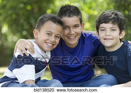 Stock Image - Hispanic boys smiling together. Fotosearch