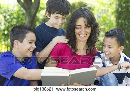 Hispanic family reading book View Large Photo Image Stock Image - Hispanic family reading book. Fotosearch
