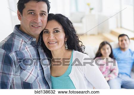 Stock Image - Hispanic family smiling together. Fotosearch