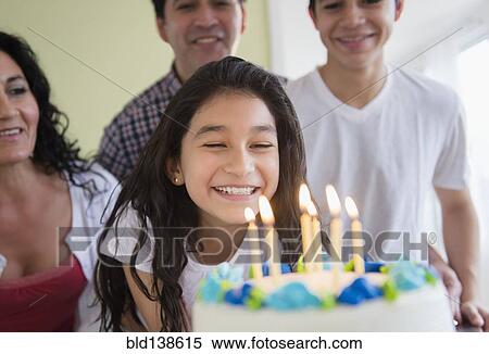 Hispanic girl admiring birthday cake View Large Photo Image Stock Photography - Hispanic girl admiring birthday cake. Fotosearch