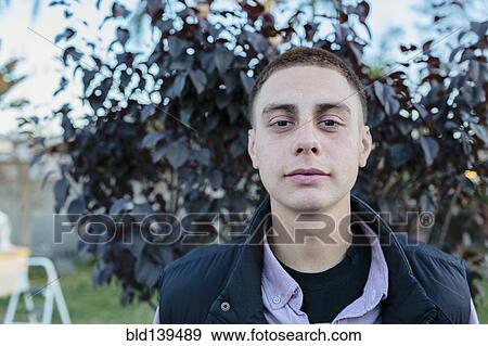 Hispanic man standing outdoors View Large Photo Image Stock Photo - Hispanic man standing outdoors. Fotosearch