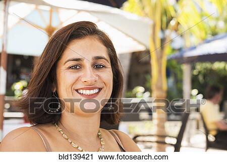 Hispanic woman smiling outdoors View Large Photo Image Stock Image - Hispanic woman smiling outdoors. Fotosearch
