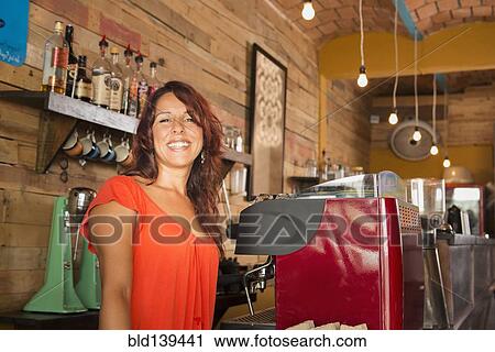 Hispanic woman working in coffee shop View Large Photo Image Stock Image - Hispanic woman working in coffee shop. Fotosearch