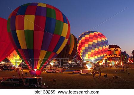 Stock Photo - Hot air balloons in field. Fotosearch