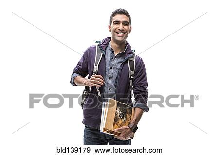 Indian student carrying books and backpack View Large Photo Image Stock Photo - Indian student carrying books and backpack. Fotosearch