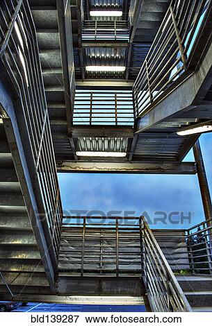 Low angle view of metal staircase View Large Photo Image Stock Photo - Low angle view of metal staircase. Fotosearch