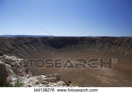 Stock Photograph - Meteor Crater under blue sky, Arizona, United States. Fotosearch