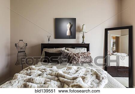 Mirror, bed and dress form in modern bedroom View Large Photo Image Stock Image - Mirror, bed and dress form in modern bedroom. Fotosearch