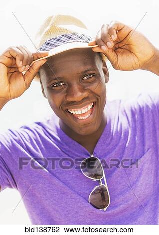 Mixed race man smiling outdoors View Large Photo Image Stock Image - Mixed race man smiling outdoors. Fotosearch