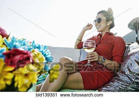 Mixed race woman drinking white wine View Large Photo Image Stock Image - Mixed race woman drinking white wine. Fotosearch